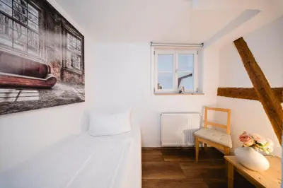 Ein Bett oder Betten in einem Zimmer der Unterkunft Landhotel im Hexenwinkel