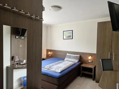 Ein Bett oder Betten in einem Zimmer der Unterkunft LandGASTHOF Rose
