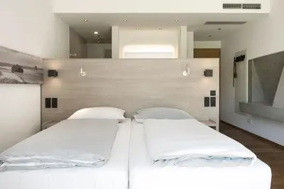 Ein Bett oder Betten in einem Zimmer der Unterkunft BURGHOF - DAS HOTEL