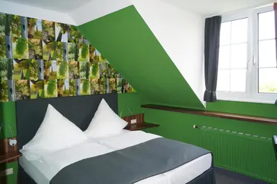 Ein Bett oder Betten in einem Zimmer der Unterkunft Bio-Weingut, Gästehaus und Kräuterhof