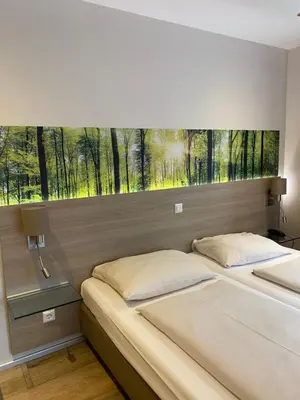 Ein Bett oder Betten in einem Zimmer der Unterkunft Hotel Scheid