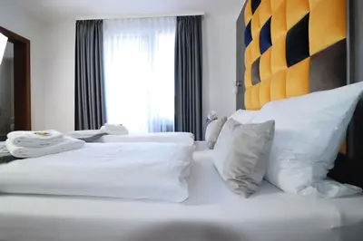 Ein Bett oder Betten in einem Zimmer der Unterkunft Hotel Kurparkblick inkl Therme und Sauna Eintritt