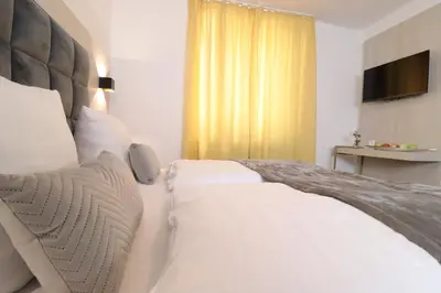 Ein Bett oder Betten in einem Zimmer der Unterkunft Hotel Kurparkblick inkl Therme und Sauna Eintritt