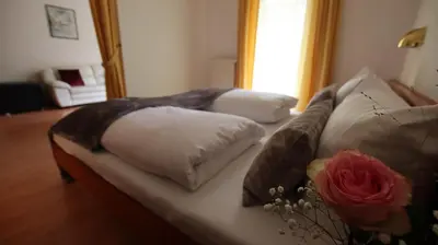 Ein Bett oder Betten in einem Zimmer der Unterkunft Hotel Kurparkblick inkl Therme und Sauna Eintritt