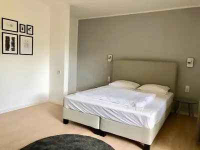 Ein Bett oder Betten in einem Zimmer der Unterkunft City Hotel und City Apartments Centrum