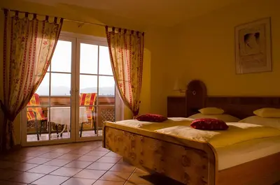 Ein Bett oder Betten in einem Zimmer der Unterkunft Gästehaus Vinetum
