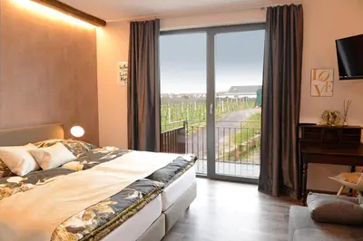 Ein Bett oder Betten in einem Zimmer der Unterkunft Vinotel Dollt-Kern