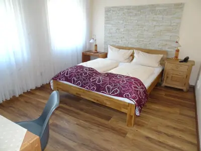 Ein Bett oder Betten in einem Zimmer der Unterkunft Hotel & Weinstube Restaurant Filling