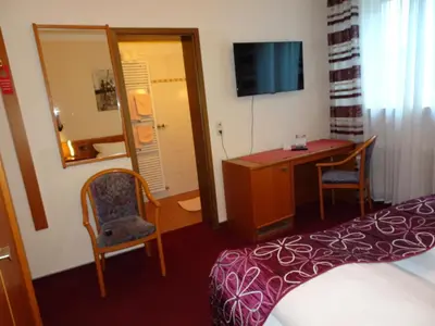 Ein Bett oder Betten in einem Zimmer der Unterkunft Hotel & Weinstube Restaurant Filling