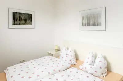 Ein Bett oder Betten in einem Zimmer der Unterkunft Wohnen im Weingut