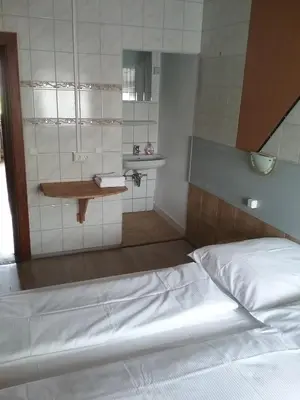 Ein Bett oder Betten in einem Zimmer der Unterkunft See Lord Hotel