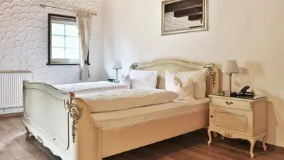Ein Bett oder Betten in einem Zimmer der Unterkunft Hotel Restaurant Mönchhof