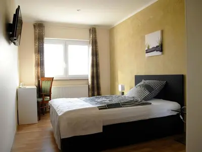Ein Bett oder Betten in einem Zimmer der Unterkunft NM-APARTMENTS