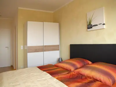 Ein Bett oder Betten in einem Zimmer der Unterkunft NM-APARTMENTS