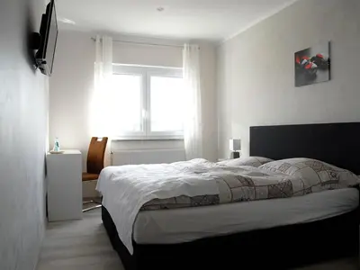 Ein Bett oder Betten in einem Zimmer der Unterkunft NM-APARTMENTS