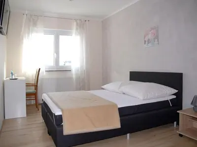 Ein Bett oder Betten in einem Zimmer der Unterkunft NM-APARTMENTS