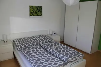 Ein Bett oder Betten in einem Zimmer der Unterkunft Ferienwohnung Schlierbachtal