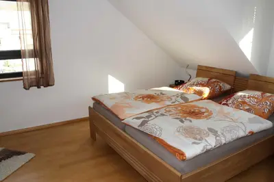 Ein Bett oder Betten in einem Zimmer der Unterkunft Ferienwohnung Schlierbachtal