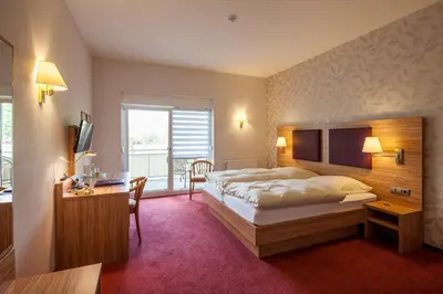Ein Bett oder Betten in einem Zimmer der Unterkunft Hotel Pfaffenhofen