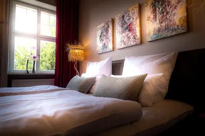 Ein Bett oder Betten in einem Zimmer der Unterkunft BLUMEINS - Das Refugium