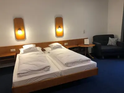 Ein Bett oder Betten in einem Zimmer der Unterkunft Gasthof Zur Krone Garni