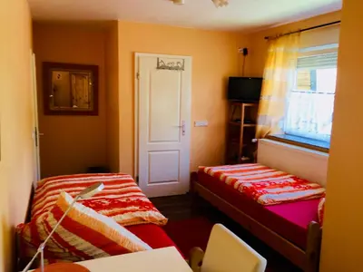 Ein Bett oder Betten in einem Zimmer der Unterkunft Gästehaus Kerle