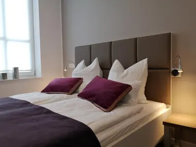 Ein Bett oder Betten in einem Zimmer der Unterkunft Trip Inn PostApart Aschaffenburg