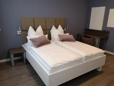 Ein Bett oder Betten in einem Zimmer der Unterkunft Trip Inn PostApart Aschaffenburg