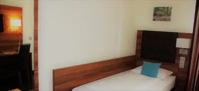 Ein Bett oder Betten in einem Zimmer der Unterkunft Hotel Germersheimer Hof