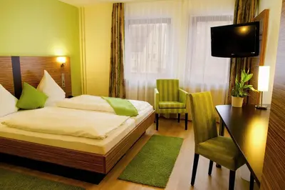 Ein Bett oder Betten in einem Zimmer der Unterkunft Gasthof Krone