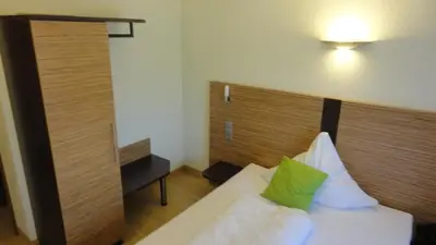 Ein Bett oder Betten in einem Zimmer der Unterkunft Gasthof Krone