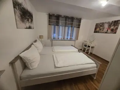 Ein Bett oder Betten in einem Zimmer der Unterkunft holidayhome Heidelberg