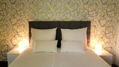 Ein Bett oder Betten in einem Zimmer der Unterkunft Hotel Schützen