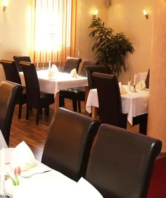 Ein Restaurant oder anderes Speiselokal in der Unterkunft Hotel zum Ochsen
