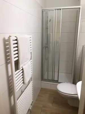 Ein Badezimmer in der Unterkunft Hotel KM