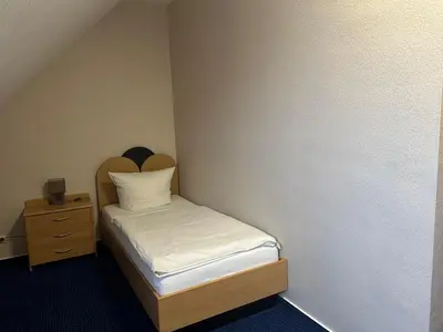 Ein Bett oder Betten in einem Zimmer der Unterkunft Hotel KM