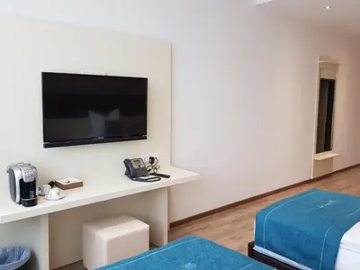 Ein Bett oder Betten in einem Zimmer der Unterkunft RheinCity Hotel & Boardinghouse