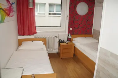 Ein Bett oder Betten in einem Zimmer der Unterkunft Hotel Erbprinzenhof