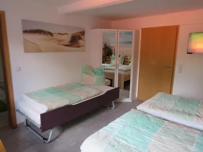 Ein Bett oder Betten in einem Zimmer der Unterkunft Die Ferienwohnung in Lörzweiler