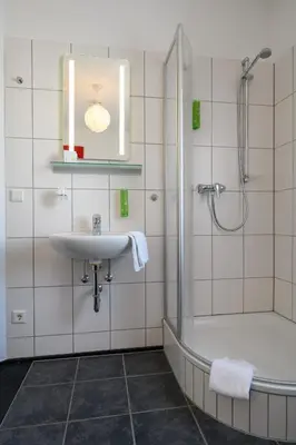Ein Badezimmer in der Unterkunft Hotel Heymann