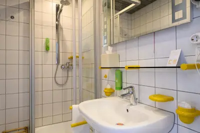 Ein Badezimmer in der Unterkunft Hotel Heymann