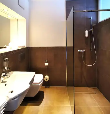 Ein Badezimmer in der Unterkunft Hotel Gutsmühle