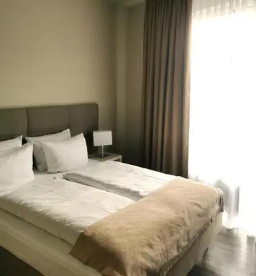 Ein Bett oder Betten in einem Zimmer der Unterkunft Hotel Gutsmühle