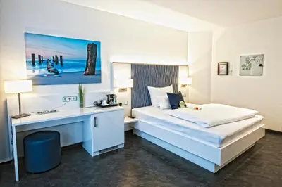 Ein Bett oder Betten in einem Zimmer der Unterkunft Hotel Jungstil