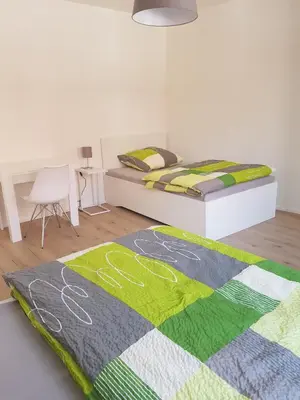 Ein Bett oder Betten in einem Zimmer der Unterkunft Quartier 