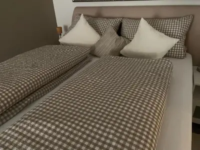 Ein Bett oder Betten in einem Zimmer der Unterkunft Fronhof 3