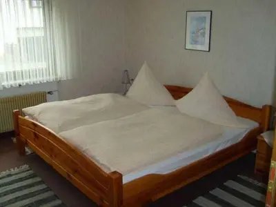 Ein Bett oder Betten in einem Zimmer der Unterkunft Ferienwohnungen Am Limespfad