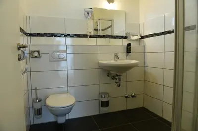 Ein Badezimmer in der Unterkunft Hotel Olive Inn