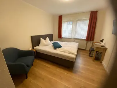Ein Bett oder Betten in einem Zimmer der Unterkunft Hotel Janssen
