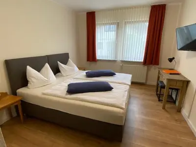 Ein Bett oder Betten in einem Zimmer der Unterkunft Hotel Janssen